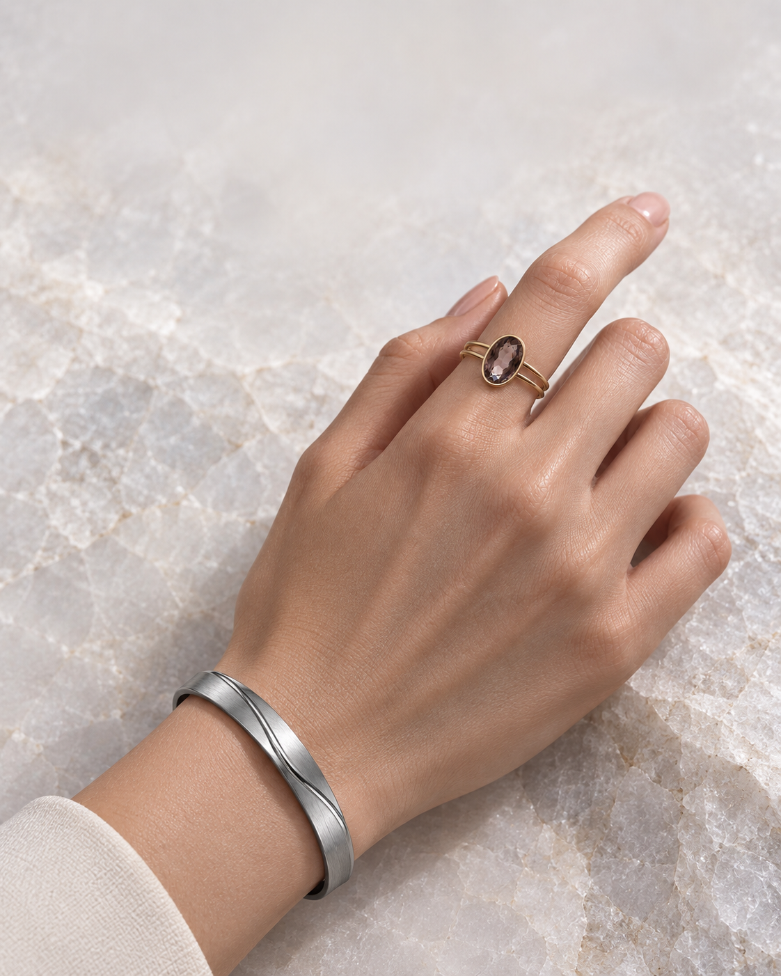 NEROVELL ring and cuff shown at worn scale