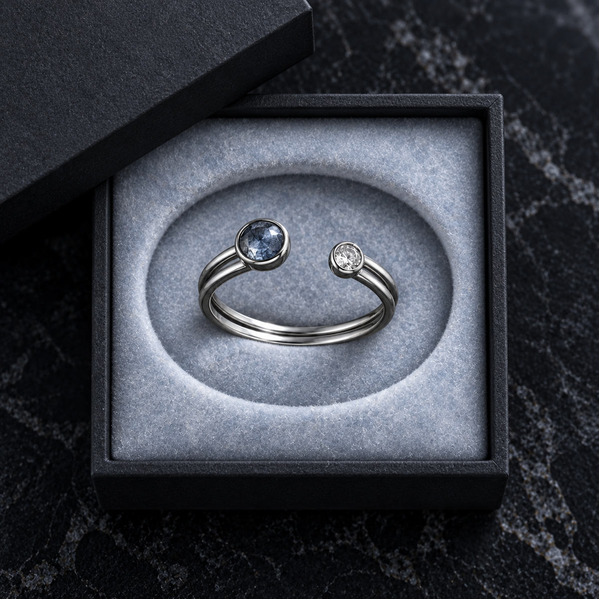 Caelum Twin Arc Ring in its presentation box