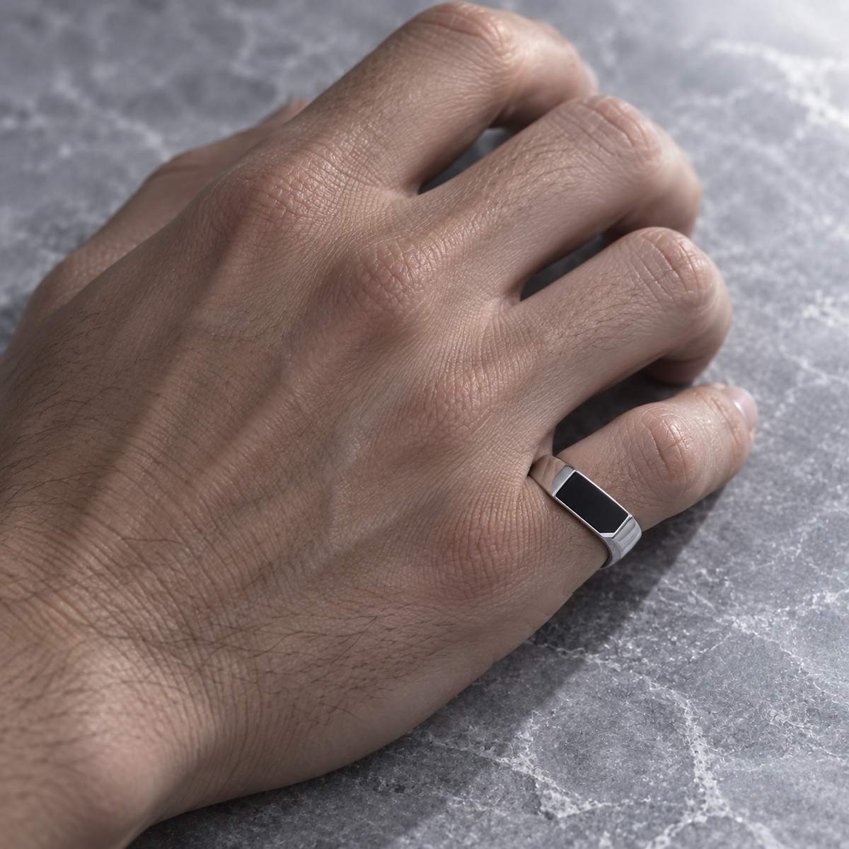 Oryn Signet Ring worn on the little finger